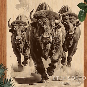 May include: Sepia-toned artwork of three bison charging forward. The bison have large horns and shaggy fur, with dust rising from their hooves. The artwork is on a light wood background, with the text "ETCH&DECO FINE CRAFT STUDIO" at the bottom.