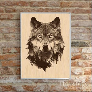 May include: Framed art print featuring a detailed illustration of a wolf's head, with a forest scene integrated into the fur. The artwork is in shades of brown and gray, set against a light wood grain background. The frame is silver, and the print is displayed on a brick wall.