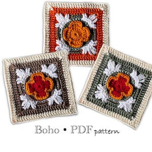 May include: Three crocheted squares with floral designs. The squares feature a central flower in orange, red, and yellow, surrounded by white leaf-like shapes. The squares have borders in orange, brown, and green. The text "Boho • PDF pattern" is at the bottom.