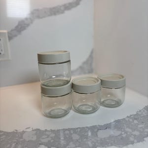 4 Glass Storage Jars with Airtight Lids 6 oz Clear Round Glass Containers for Pantry, Kitchen, Skincare, or DIY Storage.