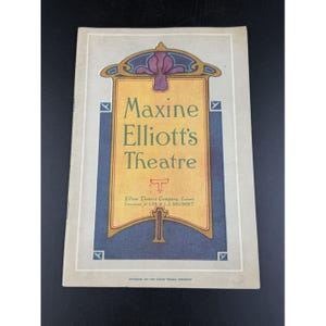 May include: A vintage theater program cover with the text "Maxine Elliott's Theatre" in gold lettering. The program has a decorative floral design at the top and bottom, with blue and gold accents. The bottom of the program includes the text "Elliott Theatre Company, Lessee, Direction of LEE & J.J. SHUBERT."
