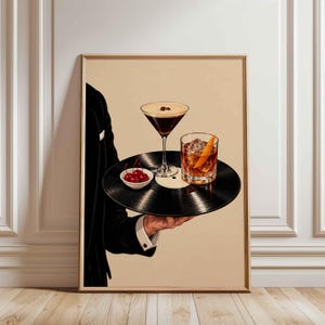 Vintage-style artwork of a suited waiter holding a vinyl record tray with an espresso martini, old fashioned cocktail, and dark cherries, featuring retro bar aesthetic, elegant glassware, warm neutral tones, and sophisticated lounge decor vibes.
