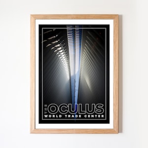 May include: Framed print featuring a photograph of the Oculus at the World Trade Center. The image showcases the building's architectural details with a focus on the interior's geometric patterns and natural light. The text "THE OCULUS WORLD TRADE CENTER" is displayed at the bottom.