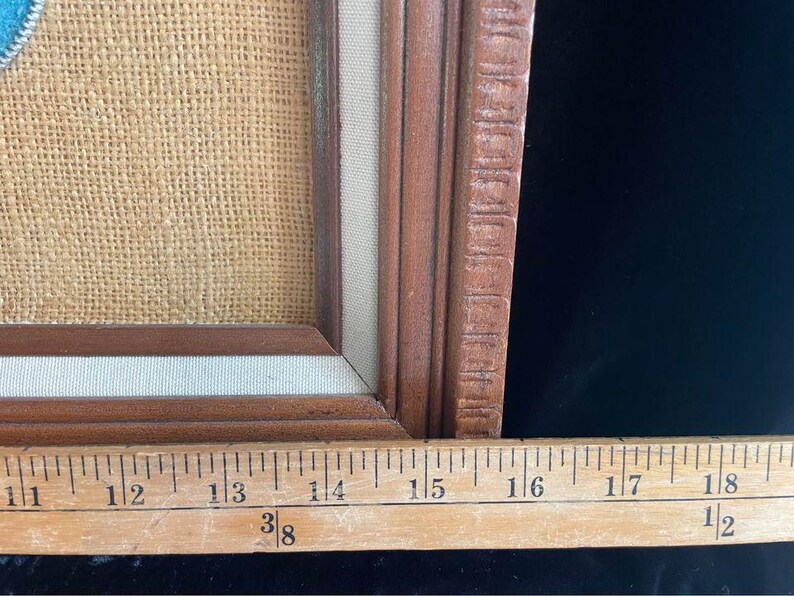 May include: A close-up of a wooden picture frame with a burlap background. The frame is 18 1/2 inches long.