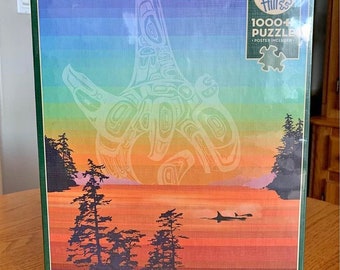 May include: A 1000 piece jigsaw puzzle featuring a colorful sunset scene with a large, white, stylized, Native American design in the sky. The design is reminiscent of a totem pole.  The puzzle box also features the text "Cobble Hill 1000 Piece Puzzle - Poster Included".
