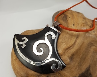 Carved Mode Black and Silver Pendant on Orange Suede Cord