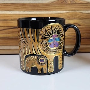 Taza LIONS de Laurel Burch, fabricada en Japón, color dorado metalizado