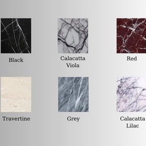 May include: A collection of six square marble samples, each showcasing a different color and pattern. Colors include black, red, grey, and white, with names like "Calacatta Viola" and "Travertine" displayed below each sample.