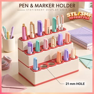 May include: A tiered, off-white pen and marker holder with red trim, featuring multiple circular slots for stationery. The unit is labeled "PEN & MARKER HOLDER" and "STATIONERY DISPLAY UNIT" with a 21 mm hole measurement indicated.