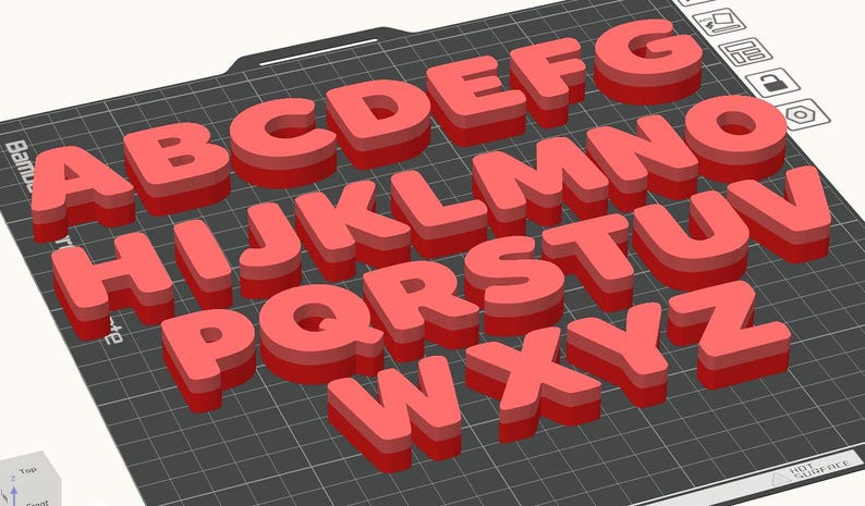 May include: A collection of red 3D alphabet letters, from A to Z, arranged on a dark gray grid. Each letter has a shadow effect, giving them a raised appearance. The letters are evenly spaced and clearly visible.