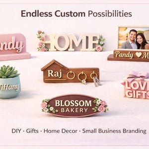 May include: A collection of custom decor items, including a pink "Sandy" sign, a "HOME" sign with floral accents, a photo frame, a succulent in a blue pot with "Tiffany" on it, a key holder with "Raj", a "BLOSSOM BAKERY" sign, and a "LOVE GIFTS" box.