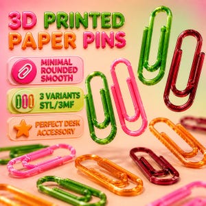 May include: A collection of 3D printed paper pins in various colors, including green, pink, orange, and red. The image features the text "3D PRINTED PAPER PINS" and other text that reads "MINIMAL ROUNDED SMOOTH", "3 VARIANTS STL/3MF", and "PERFECT DESK ACCESSORY".