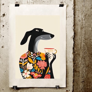 May include: Art print featuring a stylized black dog with a floral patterned shirt, holding a coffee cup with the word "TUTTI". The dog has a gray snout and is set against a cream background.