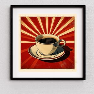 May include: A framed print featuring a cup of coffee on a saucer, set against a retro-style background of red and cream-colored rays. The coffee cup is off-white with a dark brown coffee fill.