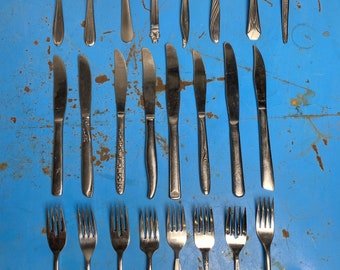 8 place settings of various Midcentury silverware