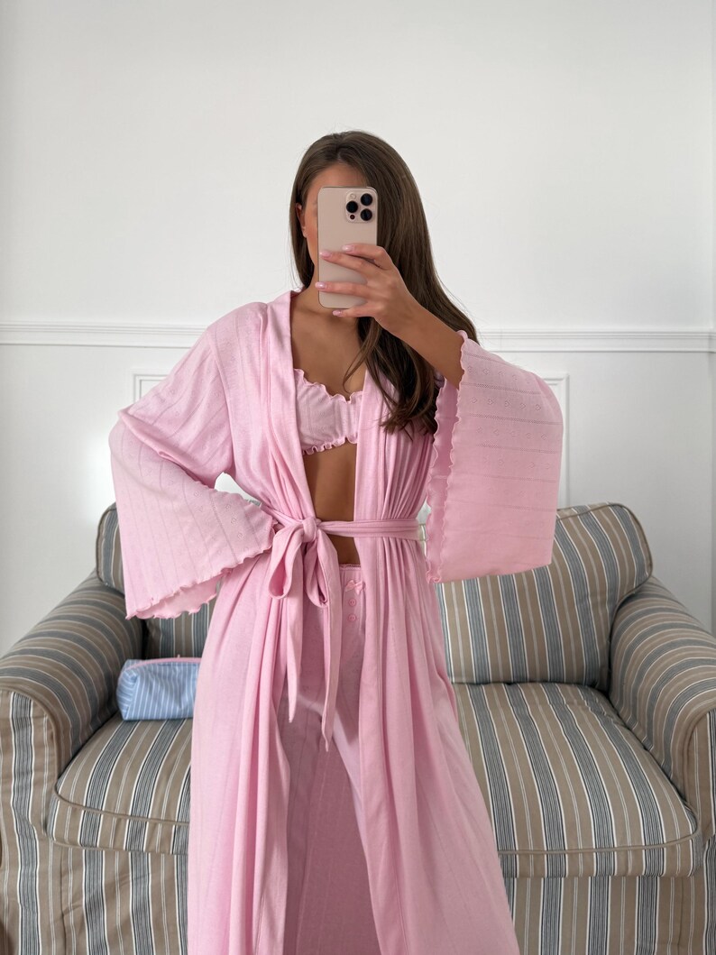 May include: A set of three ceramic nesting bowls in shades of blue, green, and white. The bowls feature a speckled glaze and a simple, modern design. The largest bowl measures approximately 6 inches in diameter.