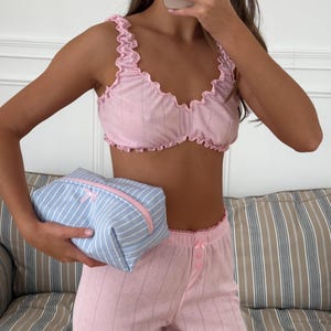 May include: A rustic wooden sign with the text "Welcome to our home" in white lettering. The sign features a distressed finish and a simple, inviting design, perfect for entryway decor.