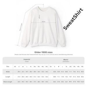 May include: White Gildan 18000 sweatshirt with size chart. The chart shows measurements in inches and centimeters for width, length, and sleeve length. The text "SweatShirt" is printed on the image.