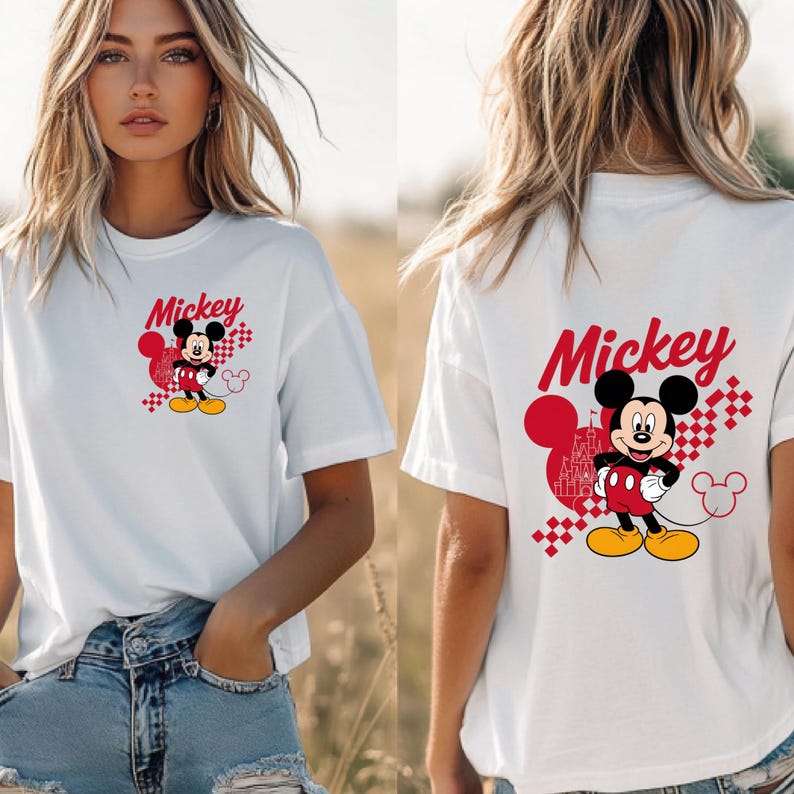 May include: White t-shirt featuring a Mickey Mouse graphic. The front of the shirt displays Mickey with the word "Mickey" in red script. The back of the shirt also has the Mickey Mouse graphic and the word "Mickey".