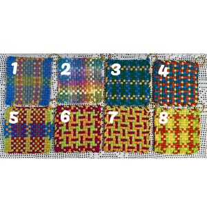 May include: Eight colorful, woven square coasters with metal ring attachments. Each coaster features a unique pattern and color scheme, including blue, green, red, and yellow. The coasters are arranged in a grid, showcasing their variety.