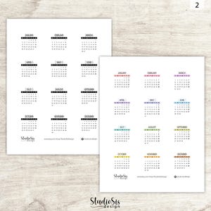 May include: Two sheets of white paper with calendar designs. One sheet features multiple years, while the other displays individual months with colorful headers. The text "Studio Sis design" is at the bottom of each sheet.