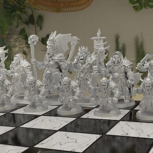May include: A chess set featuring fantasy-themed pieces. The pieces are detailed figurines of orcs and other mythical creatures, arranged on a black and white checkered board. The figures are in various poses, some holding weapons.