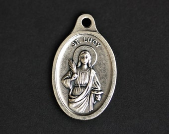 Medalla de Santa Lucía. Colgante Católico. Colgante de Santa Lucía. Encanto de Santa Lucía. Medalla de la Santa Católica. 25mm x 16mm (Cantidad 1)