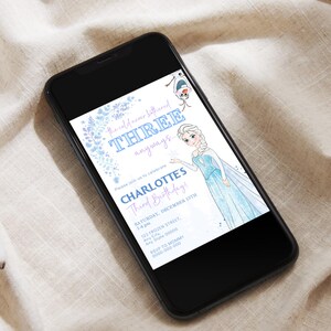 May include: A smartphone displays a birthday invitation with a Frozen theme. The invitation features Elsa, Olaf, and text that reads "the cold never bothered THREE anyways." It also includes the text "CHARLOTTE'S Third Birthday!" and party details.