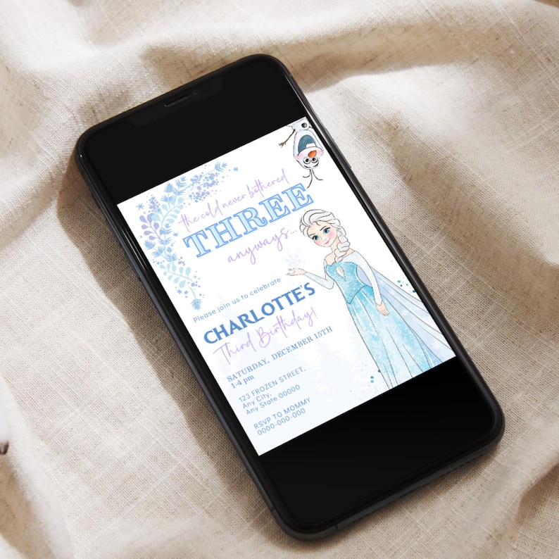 May include: A smartphone displays a birthday invitation with a Frozen theme. The invitation features Elsa, Olaf, and text that reads "the cold never bothered THREE anyways." It also includes the text "CHARLOTTE'S Third Birthday!" and party details.