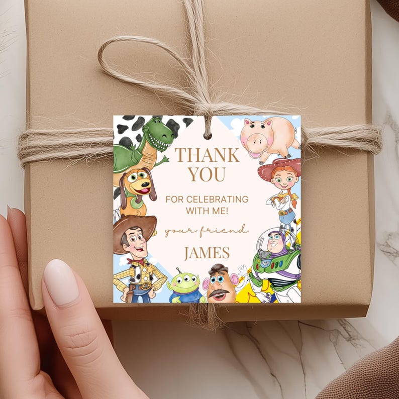 May include: A square gift tag with cartoon characters from Toy Story. The tag reads "THANK YOU FOR CELEBRATING WITH ME! your friend JAMES". The tag is tied to a brown wrapped gift with twine.