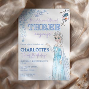 May include: A birthday invitation featuring Elsa from Frozen. The invitation reads "the cold never bothered THREE anyways..." and "CHARLOTTE'S Third Birthday!" with event details. The design includes snowflakes and a watercolor effect.