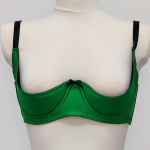 emerald green Gina quarter cup bra with black straps, trim and bow.