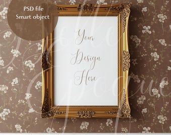 May include: A gold ornate picture frame with the text "Your Design Here" on a white background. The frame is rectangular with detailed carvings and a glossy finish. The background is a brown floral wallpaper.