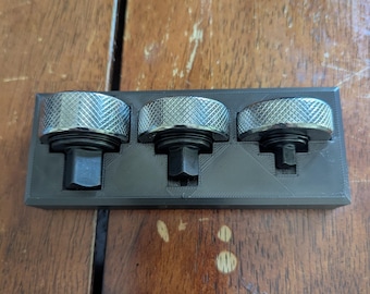Thumb ratchet holder