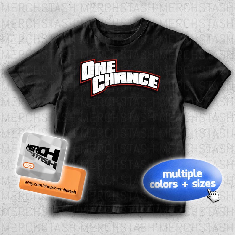 May include: Black t-shirt with the text "ONE CHANCE" in white letters with a red outline. The shirt also has a shop logo and a blue oval with the text "multiple colors + sizes".