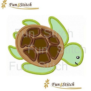 May include: Green and brown embroidered applique of a turtle with a smiling face. The turtle has a brown shell with five sections and green flippers.