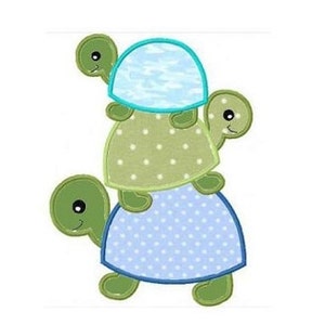 May include: A stack of three green and blue cartoon turtles with smiling faces. The turtles are stacked on top of each other, with the smallest turtle on the bottom and the largest turtle on top.