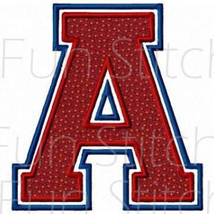 May include: A red letter "A" with a blue outline and white accents. The letter has a dotted texture and is likely an embroidered patch or applique. The design is bold and suitable for apparel or crafts.