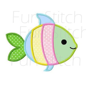 May include: A green, yellow, pink, and blue fish with a black eye and a green tail with white polka dots. The fish has a light blue fin on its back.