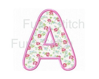 May include: A pink floral patterned letter A with a pink outline.