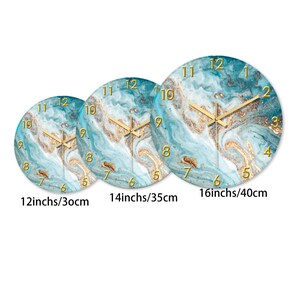 May include: Three round wall clocks with a blue and gold marble design. The clocks are 12 inches, 14 inches, and 16 inches in diameter. Each clock has gold hands and numerals.
