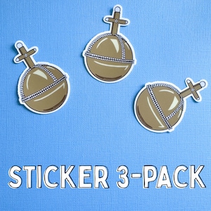 May include: Three stickers featuring a brown orb design with a cross on top and a white border, set against a light blue background. The text "STICKER 3-PACK" is displayed at the bottom in white block letters.