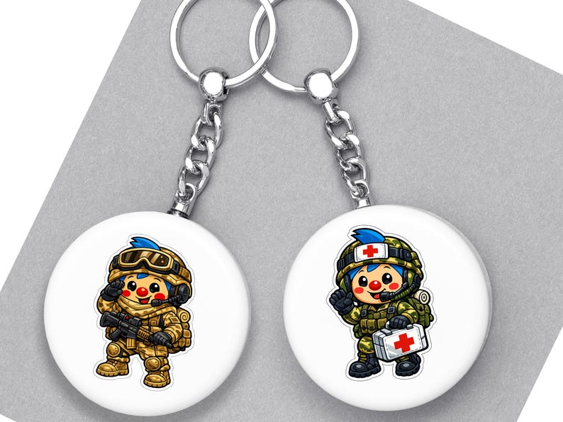 May include: Two white round keyrings with cartoon soldier designs. One shows a soldier with a rifle, the other a medic with a first aid kit. Both have silver chains and key rings.