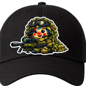 May include: Black baseball cap with a cartoon illustration of a character in camouflage clothing, wearing goggles and saluting. The character is holding a sniper rifle. The design has a white border.
