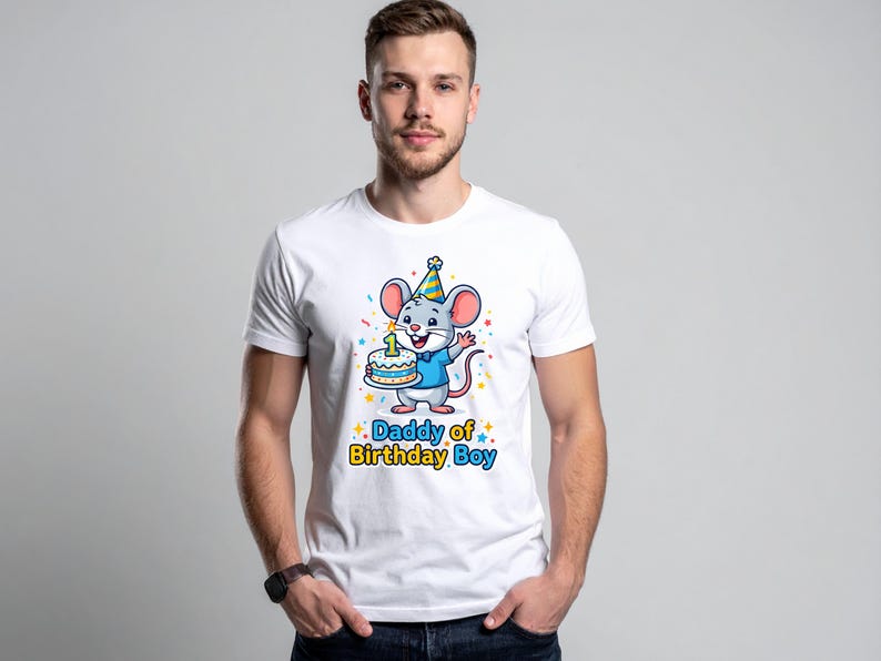 May include: White t-shirt featuring a cartoon mouse wearing a party hat and holding a birthday cake with a number one candle. The text "Daddy of Birthday Boy" is printed below the mouse in blue and yellow.