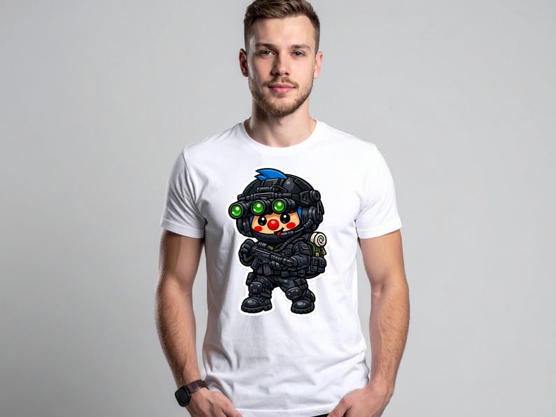 May include: White t-shirt with a cartoon soldier graphic. The soldier is depicted in black tactical gear, including a helmet with green night vision goggles and blue hair. The design is centered on the white t-shirt.