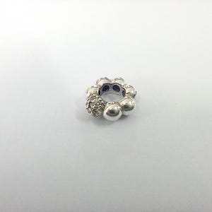 May include: A set of three ceramic mugs with a speckled, matte finish. The mugs are in shades of cream, light gray, and dark gray. Each mug has a simple, minimalist design and a rounded handle.