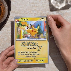 May include: A Pikachu-themed birthday invitation featuring a yellow and blue design. The invitation includes the name "Oliver", the number "7", and event details. The card is held by a person.