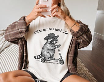 Off to Cause a Kerfuffle Comfort Colors® Shirt, Funny Raccoon Graphic Tee, Cowboy Raccoon Shirt, Western Meme Gift