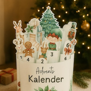May include: A white Advent calendar with festive illustrations of reindeer, elves, gingerbread men, and a Christmas tree. The calendar has numbered compartments and the words "Advents Kalender" printed on the front.